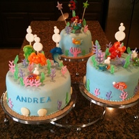 The Little Mermaid MMF for cake icing. Royal icing for greens and weeds. Jelly bean fishes. Color flow for air bubbles. Lollipop dolphin, crab, etc. (the big...