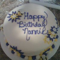 Purple And Yellow Birthday Cake This is our 2nd fondant cake. This one went SO much better than the 1st one. This is a simple cake but it turned out really nice. (yellow...