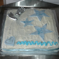 Christening Cake This was made in a very big hurry for my sons christening - and then my other son decided to wipe his finger along and test the icing after...