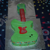 Guitar I made a chocolate guitar for my sons 7th bday. The red pieces are fondant, the green is buttercream and I painted the strings on with...