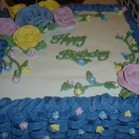 Birthday Cake Cinnamon Swirl cake with buttercream filling and icing. RI flowers.