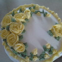 Yellow Roses Friend requsted a cake for a bereavement dinner. Was the deceased favorite cake. White cake with Lemon curd filling. Her favorite flowers...