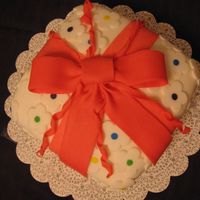 With A Bow On Top. This is a yellow cake with bc and fondant.