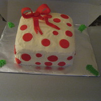 Christmas Gift Square Christmas box, cream cheese/buttercream icing, red fondant bow and circles.