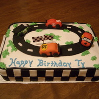 Nascar Cake For a 4 year old birthday party. All the accents are made of fondant.