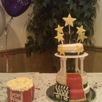 Sweet 16 For a Hollywood sweet 16 party. The popcorn is made from marshmallows and painted with yellow coloring. All accents are fondant.