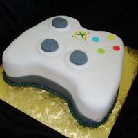 X-Box Controller Coworker's husband is a video game fan. This was for his birthday. Lemon cake with fondant.