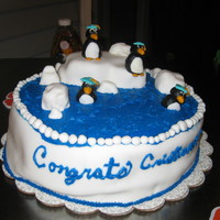 Penguins, Graduation it was really humid out and hot so the fondant started to lift off the cake on sides. very dissapointing