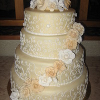 Neutral Coloured Wedding Cake Lots of flowers -bride wanted only a single diagonal line going down -I would have added more, but hey, less to make! My first official...