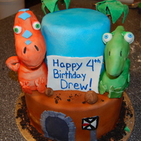 Dinosaur Train Cake Cake for a boy who loves PBS's dinosaur train; dinosaurs are made from rkt covered in fondant. The bottom layer is the "time...