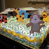 Zoo Animals zoo animals for a baby shower. 1/2 sheet cake baby blue van cake with rum. that's what the customer asked for. plus A..B..C blocks