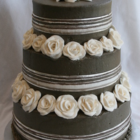 Second Marriage this was a second marriage. the bride asked me to match the fabric of her dress, a taupe ,mauve, off white and silver weave.