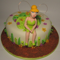 Tinkerbell Cake This cake was done for a Tinkerbell's fan. The cake is buttermilk cake filled with dulce de leche.