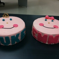 Twin Baby Faces For A Baby Shower Double layer 10" rounds for each. Buttercream "skin" with fondant names on the front, fondant hair, eyes, nose and '...