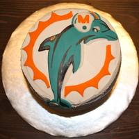 Miami Dolphins Logo Small logo made on 6" rounds...all cut out of fondant with exacto.