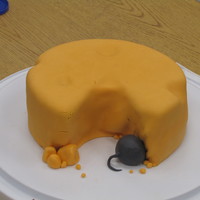 Cheese Chunk With Mouse I made this for a co-worker who LOVES cheese. Two 8" rounds covered with fondant. Mouse butt/tail also made out of fondant, as are the...
