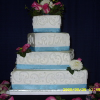 Ross And Mesha Thompson / Wedding 9-26-09 My niece's wedding cake. Vanilla cake with Vanilla buttercream icing and half raspberry and icing filling. 16in, 12in, 8in & 6in....