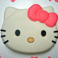 Hello Kitty Vanilla cake, vanilla buttercream, covered in MMF. Used Hello Kitty cake pan...