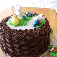 Easter Bunnies And Chick The basket weave is chocolate buttercream. The bunnies and chick are fondant.