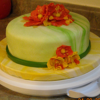 Wilton Course 4 Fondant My Wilton Course 4 cake. Marbleized MMF in greens for the cake and marbleized yellows for the cake board. I first made the bright orange...