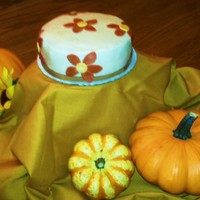 Fall Flowers Just for fun. 6" yellow w/ BC icing and fondant flowers & border. First time working with fondant and I loved it!