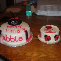 1St Birthday Fondant covered big cake and buttercream iced little cake with fondant accents.