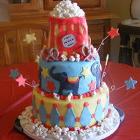 Circus Themed Birthday Cake 10" white cake, buttercream icing and marshmallow fondant. 8" chocolate, BC icing and MM fondant. Popcorn bag, was 1/4 sheet cake...