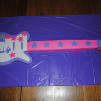Hannah Montana Guitar Made for 3 little cousins birthday. They were all having a party together and love Hannah Montana. I also did 3 small individual cakes for...