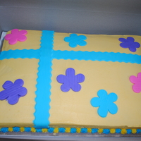 Present Cake This was made for a friends birthday. She loved the other package cake I made but she wanted different colors and flowers instead of polka...