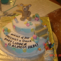 Teddy Bear Baby Cake My first time ever using gumpaste. All accessories (teddy bear, blocks, buttons, blanket and bootie) are made from gumpaste. Cake is...