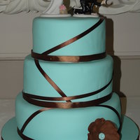 Teal And Brown Round Ribbon 12",10", 8" rounds covered in fondant with gumpaste anemone. My very first wedding cake. There are some flaws and things I...
