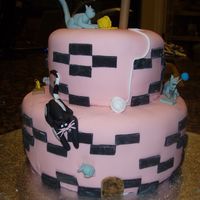 Mariana's Kitty Birthday Cake This is my second cake. I got to sculpt things this time! Thought it would be a disaster, but the cats turned out better than I thought!...