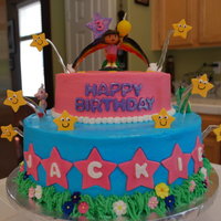 Dora And Estrellas Buttercream with fondant stars and letters. Isomalt to suspend the stars and for the hand painted rainbow.