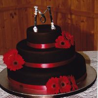 Godchilds Wedding Cake Her colors were brown and red, she wanted something very simple...used satin ice chocolate dark fondant, first layer is almond sour cream...