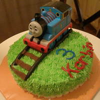 Thomas The Train Just a small cake I did for my son's birthday day since we were having his party on a different day. Thomas is a toy.