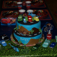Cars Cake This is a Cars cake I did for my son! He is in love with all the characters so we got him all the cars as a gift and also decorated the...