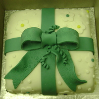 Birthday Present This is a spiced cake, with a cream cheese filling / dirty ice.Covered in vanilla fondant.