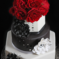 Black And White Wedding Cake Gumpaste decorations with rhinestone accents. Fresh roses on top.Thanks for looking!