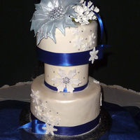 Winter Snowflake Wedding This was my 1st wedding cake! I was pleased with how it turned out.Top layer is raspberry lemonade with raspberry filling and lemon...