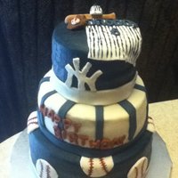 New York Yankee new york yankee 10",8" and 6" round. iced in buttercream with fondant decorations! tfl