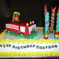 Elmo With Fire Truck Elmo with fire truck for a three year old. With white cake and raspberry lemon filling.