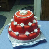 Red And White Wedding Cake I got an order last minute for a wedding cake. They wanted red marshmallow fondant and white roses. Left the design up to me. This is what...