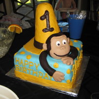 Curious George Cake Got this Idea from a lot of cakes I saw here. The Hat & Georges face are made of RKT covered in Fondant. I wasn't 100% happy with...