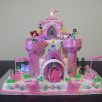 Disney Princess Castle Cake Cake is made using 9 x 13 sheet cake for bottom layer; 8 inch, round for second tier, and 6 inch, round for top tier. All buttercream and...