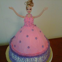 My First Barbie Doll Cake! This was my first attempt at a doll cake. I used the Wilton wonder mold cake pan set. Barbie is set on top of a 10 inch 2 layer round cake...