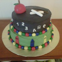 Back To School/teacher Appreciation Cake Cake is a 2 tier, round cake using buttercream icing and fondant accents. (I'm still working on getting my buttercream completely...