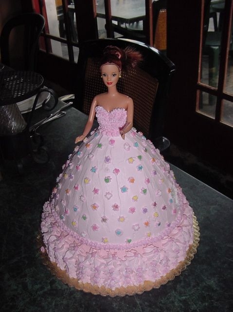 Barbie Doll Cake real Barbie doll in cake, covered in whipped cream