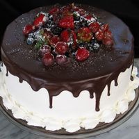 Phyllis Cake Dark chocolate ganache cascading down, fresh fruits atop