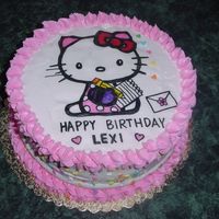 Hello Kitty Cake Cake covered with whipped cream and edible paper picture of Hello Kitty