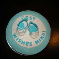 Baby Sneakers This is a cake I made for a woman who has not yet had the baby, but her co-workers wanted to throw her a going-away/shower cake. First time...